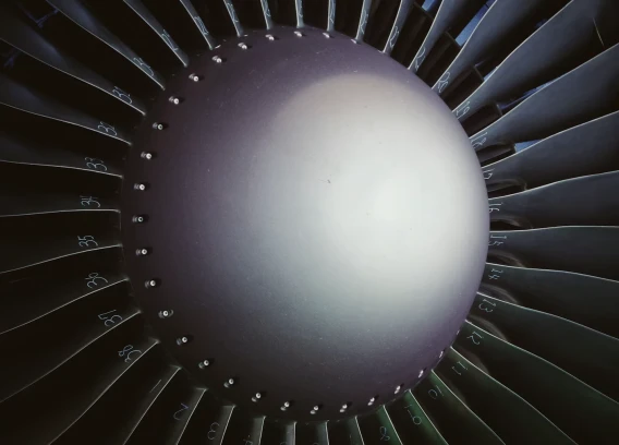 Close-up view of jet engine turbine blades.