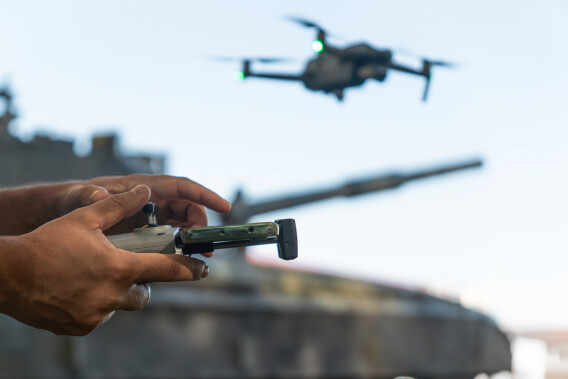 Man with a UAV control panel in his hands,